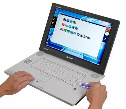 Hands on Toshiba Qosmio G40-10E laptop with open screen.