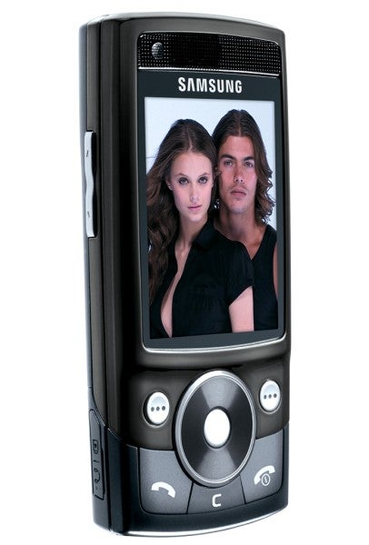 Samsung SGH-G600 phone displaying a photo of two people.
