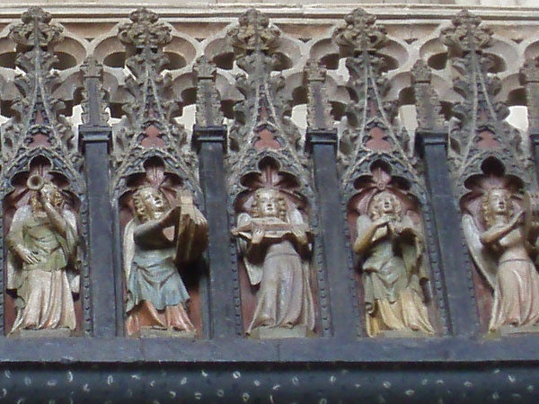 Sculpted figures on a Gothic cathedral facade.