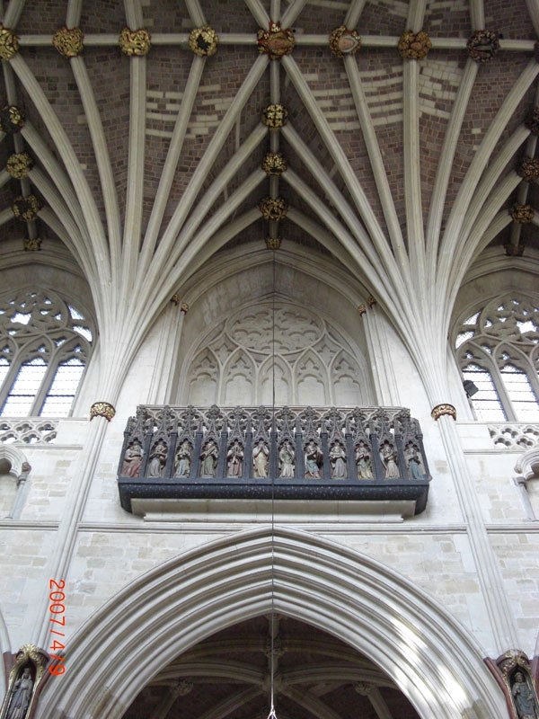 Cathedral ceiling and ornate sculpture photographed with a camera.