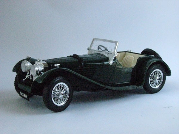 Model of a vintage black sports car with chrome details
