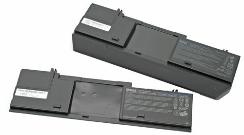 Dell Latitude D430 laptop batteries displayed on a surface.
