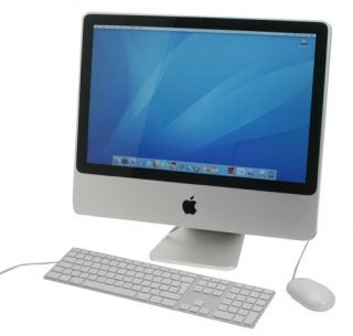 Apple iMac 20-inch with keyboard and mouse on white background.