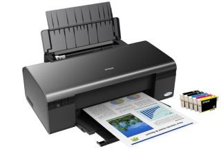 Epson Stylus D120 printer with printed color graphics.