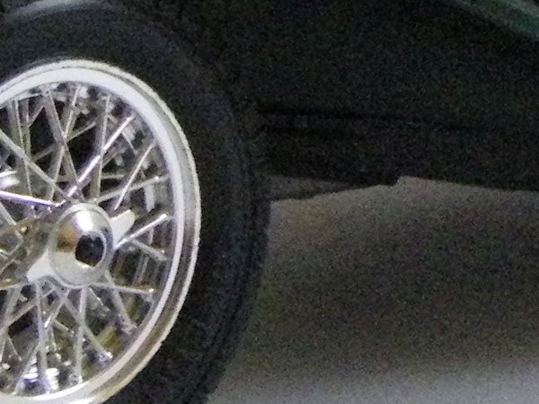 Close-up of a car wheel with a spoke design.