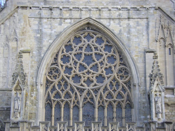 Gothic church window with intricate stone tracery.