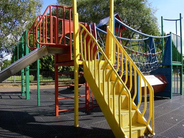 Colorful playground equipment with slide and climbing nets