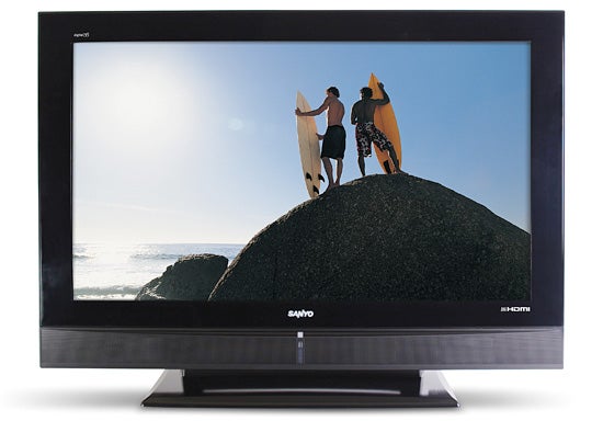 Sanyo 32-inch LCD TV displaying a beach surfing scene.