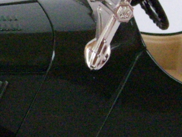 Close-up of a stylus on a black turntable.