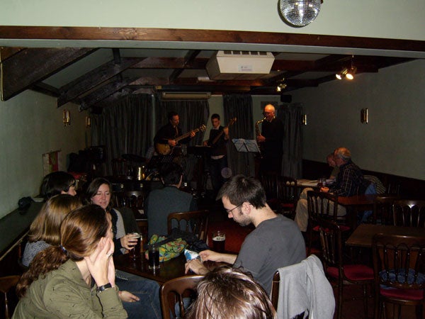 People enjoying a live jazz performance in a cozy bar.