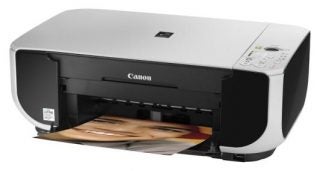 Canon PIXMA MP210 printer with a photo printout.