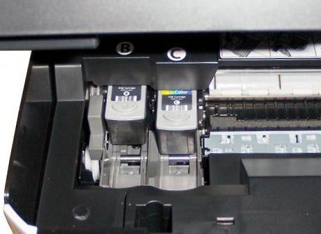 Canon PIXMA MP210 printer's open cartridge compartment.