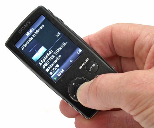 Hand holding Sony Walkman NWZ-A815 with screen on.
