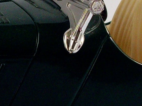 Close-up of Pentax Optio E40 camera's corner and strap hook.