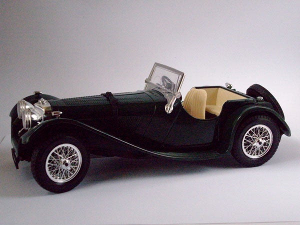 Vintage car model on a plain background.