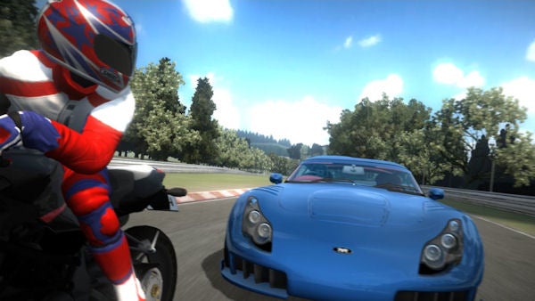 Motorcycle and car racing on a track in Project Gotham Racing 4.