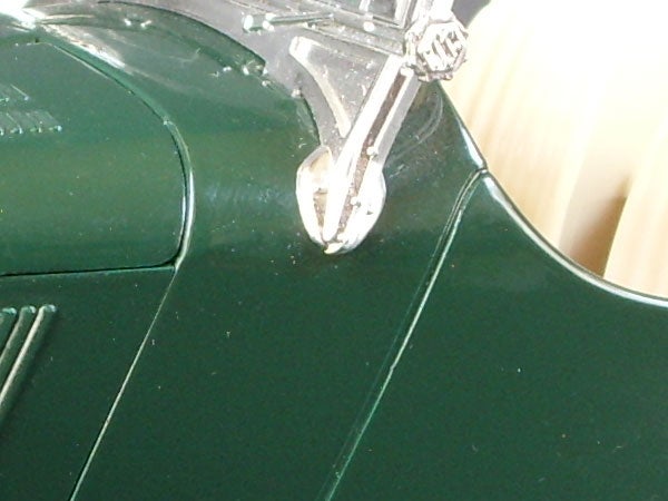 Close-up of a green electronic device with chrome details