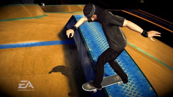Skater performing a grind at a skatepark.