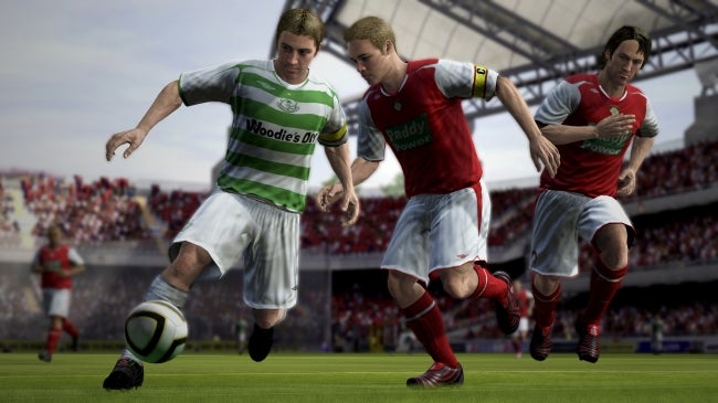 In-game action scene from FIFA 08 with players competing for the ball.