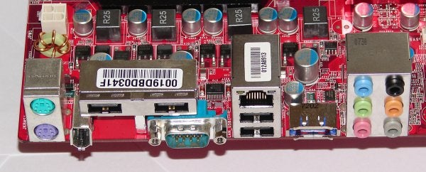 MSI K9A3 CF motherboard rear I/O ports and capacitors.