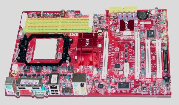 MSI K9A3 CF Motherboard with red PCB and multiple slots.