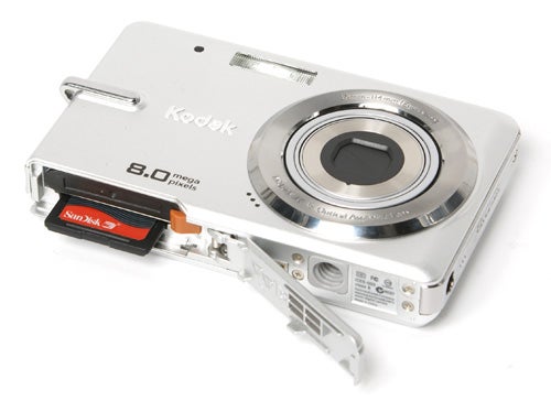 Kodak EasyShare M873 camera with open memory card slot.
