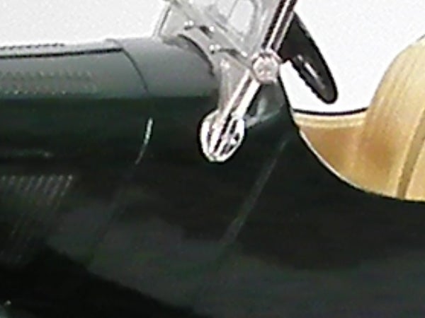 Blurred close-up of a camera's lens hood.