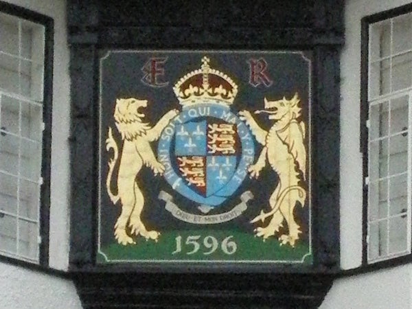 Coat of arms plaque on building with date 1596.