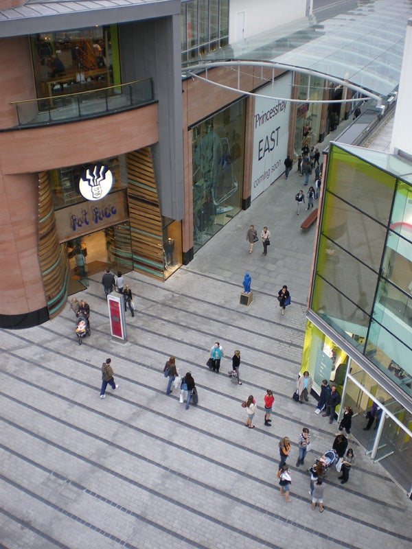 Overhead view of shopping center entrance with people walking