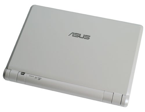 Asus Eee PC 4G 701 laptop closed on white surface.