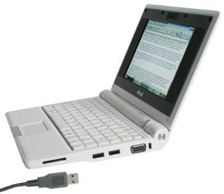Asus Eee PC 4G 701 netbook with open screen and USB cable