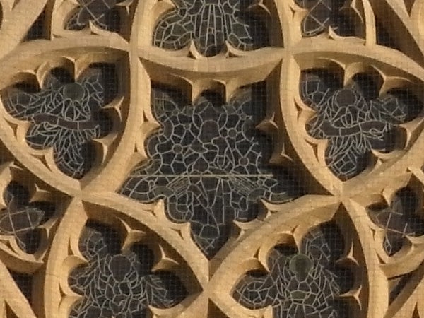 Intricate gothic stone tracery, close-up detail photograph
