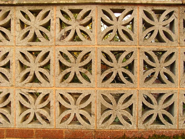 Decorative brick wall with geometric patterns.