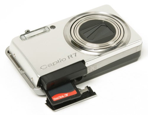 Ricoh Caplio R7 camera with open memory card slot.