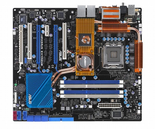 Asus Maximus Extreme motherboard with cooling pipes and slots.