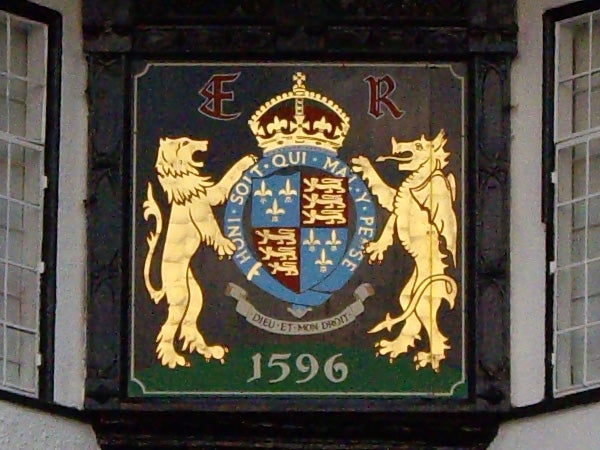 Royal coat of arms on a plaque with the date 1596.