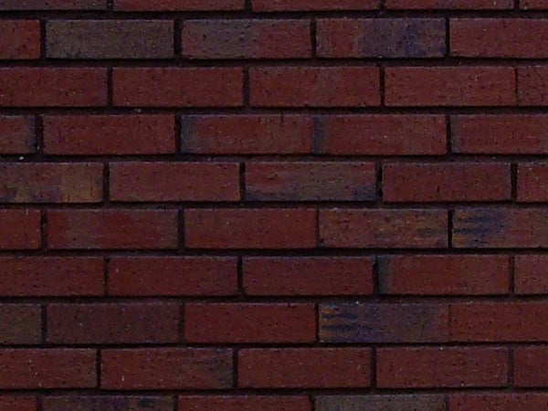 Close-up texture of a red brick wall.