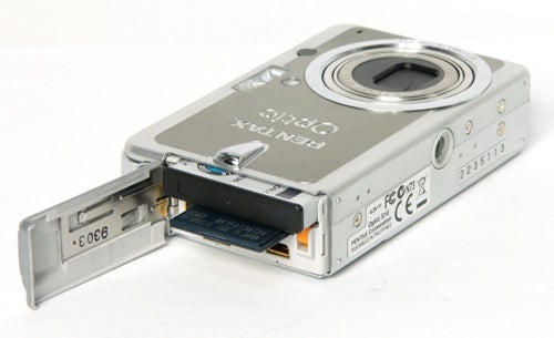 Pentax Optio S10 camera with open battery compartment.