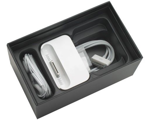 Apple iPhone box with included accessories displayed.