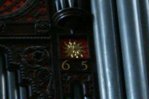 photo of ornate fixture with numbers 65.