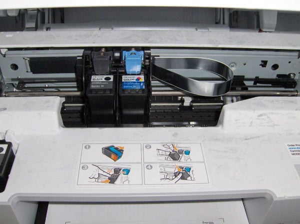 Open Dell Photo 928 printer showing ink cartridges and instructions.