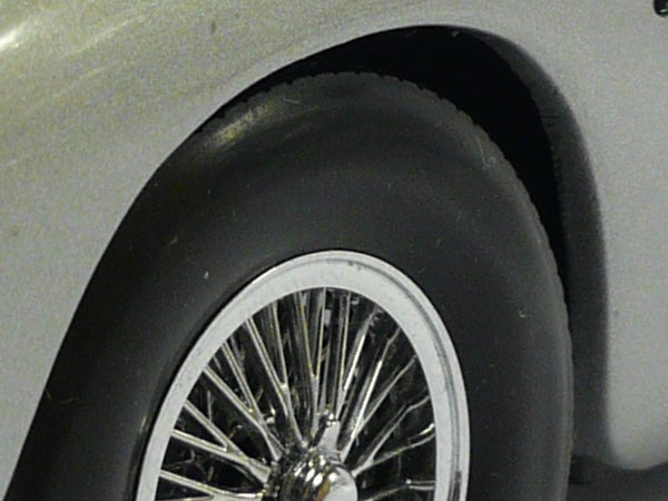 Close-up of classic car wheel with wire spokes