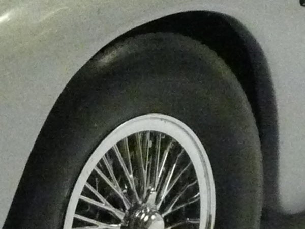 Close-up of a car wheel with spokes