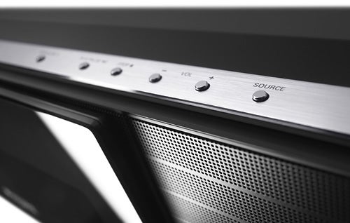 Close-up of Philips HTS8100 Soundbar control buttons and speaker grille.