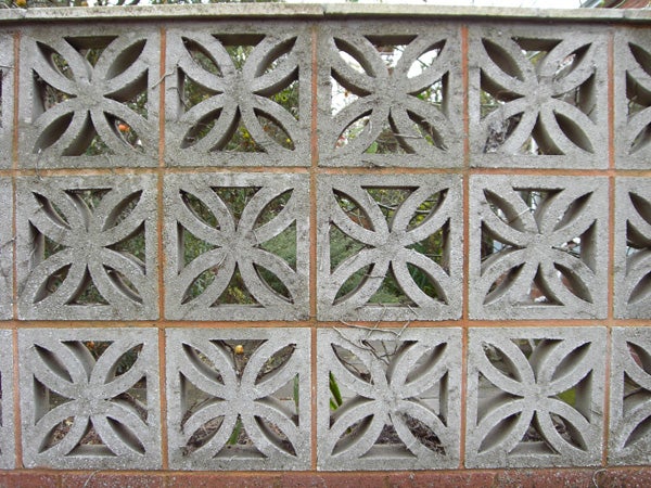 Decorative concrete block wall with symmetrical patterns.Decorative concrete block wall with geometric patterns.