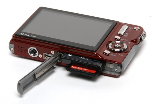 Casio Exilim EX-S880 camera with open battery compartment.