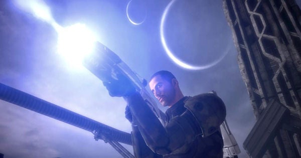 Mass Effect character holding a gun with alien architecture and moons.Commander Shepard from Mass Effect with weapon on alien planet.