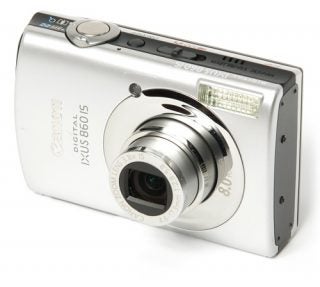 Canon IXUS 860 IS digital camera on white background.