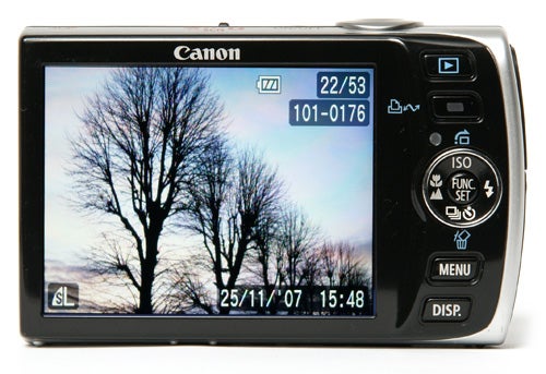 Canon IXUS 860 IS camera displaying a tree silhouette.Canon IXUS 860 IS camera with a displayed photo of trees.