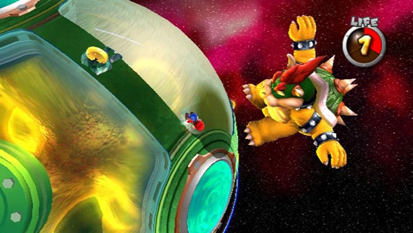 Super Mario Galaxy gameplay showing Mario avoiding Bowser.Super Mario Galaxy gameplay with Mario avoiding Bowser.